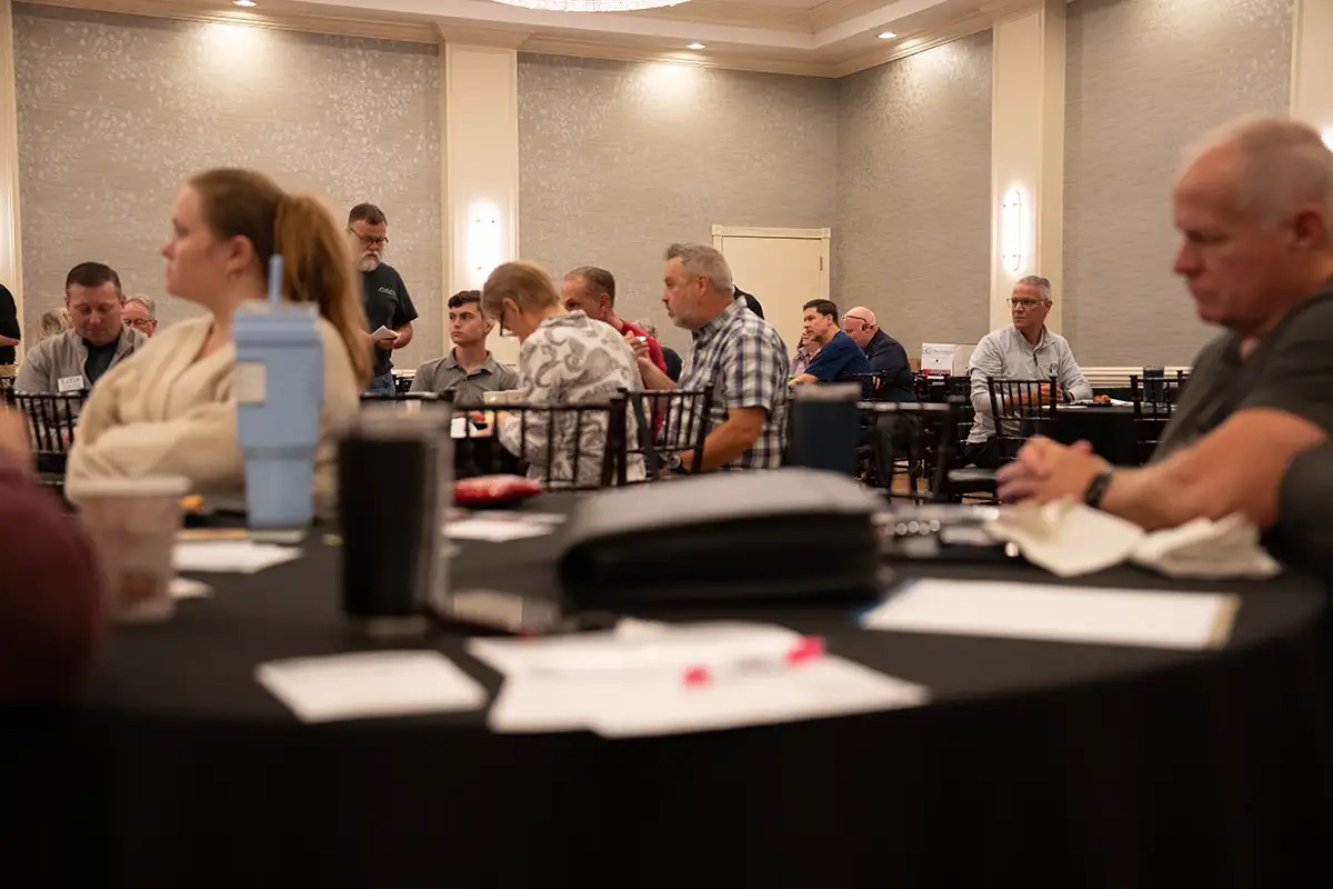 People sitting at LeTip event listening to speaker